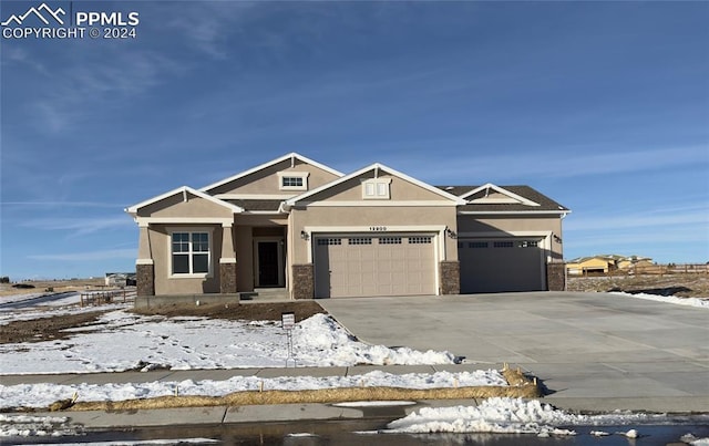 craftsman inspired home with a garage