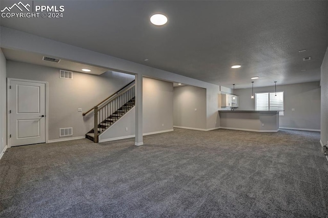 basement with dark colored carpet