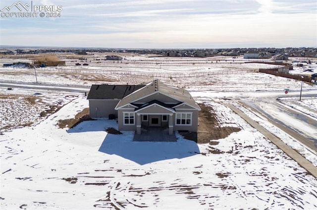 snowy aerial view with a rural view