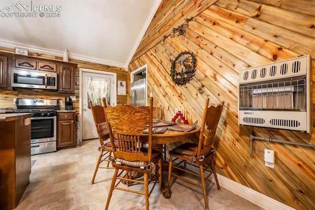 dining space featuring wooden walls, vaulted ceiling, heating unit, and light tile patterned floors