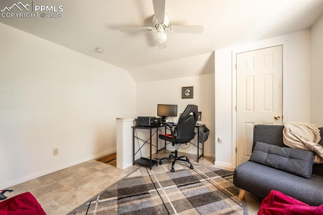 office space featuring tile patterned flooring, ceiling fan, and vaulted ceiling