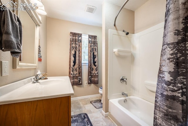 full bathroom with tile patterned floors, vanity, shower / bath combo, and toilet