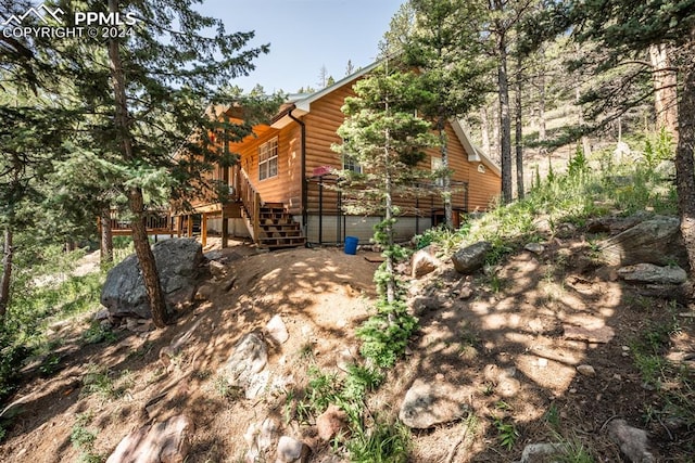 view of side of property featuring a deck