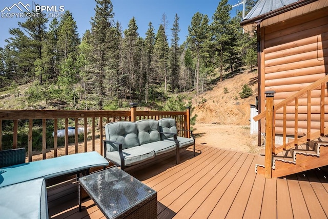 wooden terrace with an outdoor hangout area