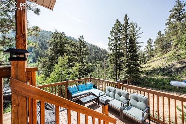 wooden deck with an outdoor hangout area