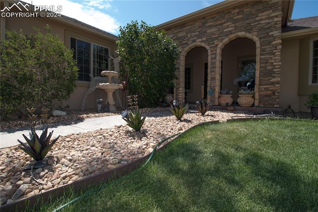 1933 Top Notch Trl, Penrose, CO 81240 - exterior space with a front yard, stucco siding, and stone siding
