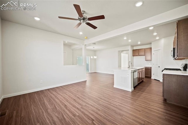 kitchen with recessed lighting, stove, a sink, stainless steel dishwasher, and dark wood-style floors