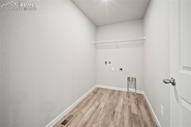 laundry room with washer hookup, light hardwood / wood-style flooring, and electric dryer hookup