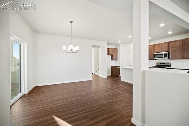 kitchen with dark wood-style floors, baseboards, appliances with stainless steel finishes, and recessed lighting