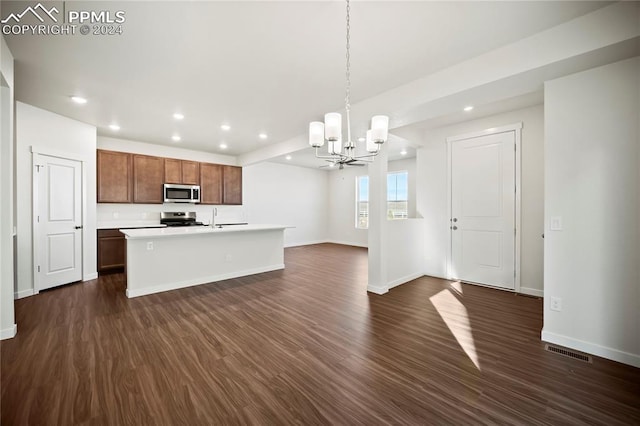 kitchen with dark wood-style flooring, visible vents, open floor plan, light countertops, and appliances with stainless steel finishes