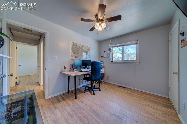 office featuring ceiling fan and light wood-type flooring