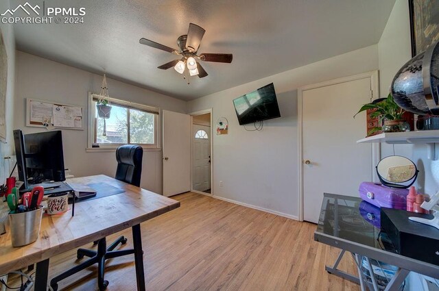 office space with light wood-type flooring and ceiling fan