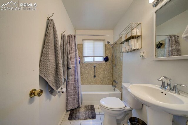 bathroom with tile patterned flooring, toilet, and shower / tub combo with curtain