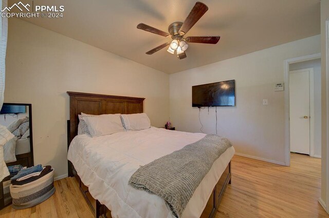 bedroom featuring light wood-type flooring and ceiling fan