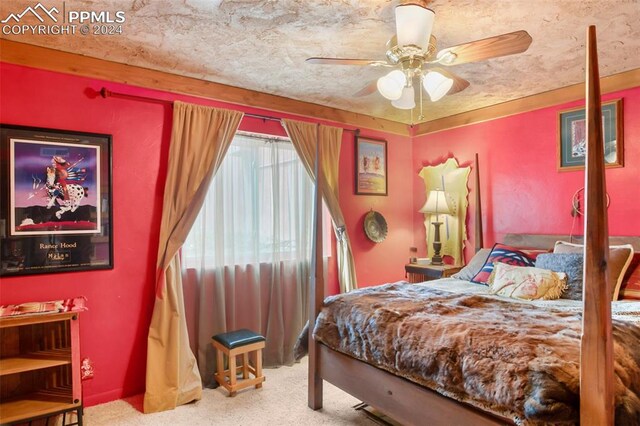 carpeted bedroom with ceiling fan