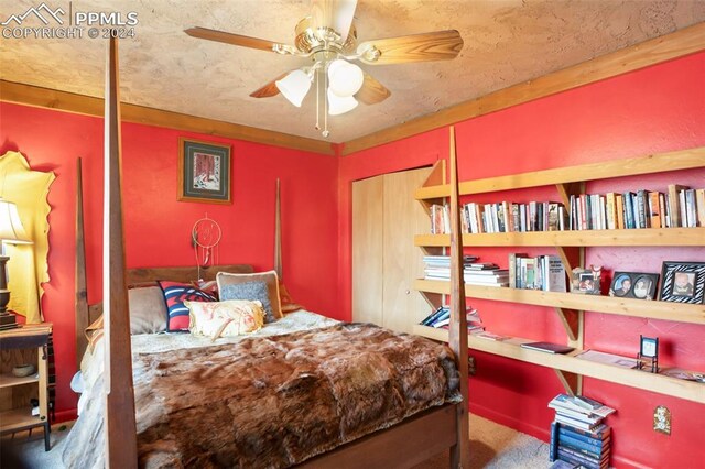 bedroom featuring ceiling fan and carpet flooring