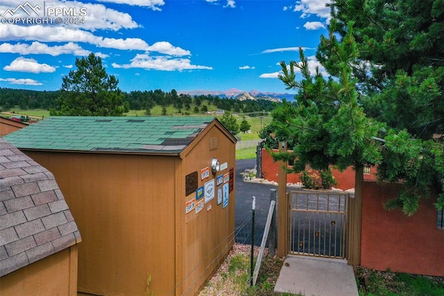 view of outbuilding featuring a mountain view