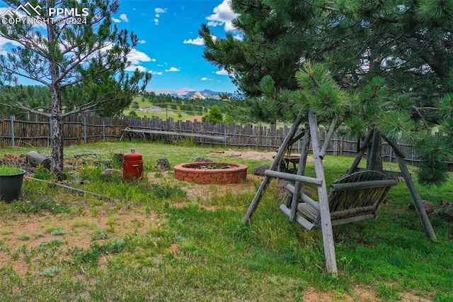 view of yard with an outdoor fire pit