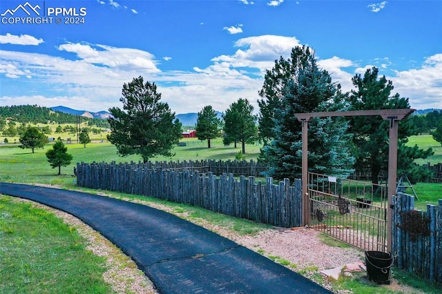 exterior space featuring a mountain view and a yard