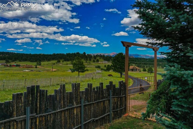 view of yard with a rural view