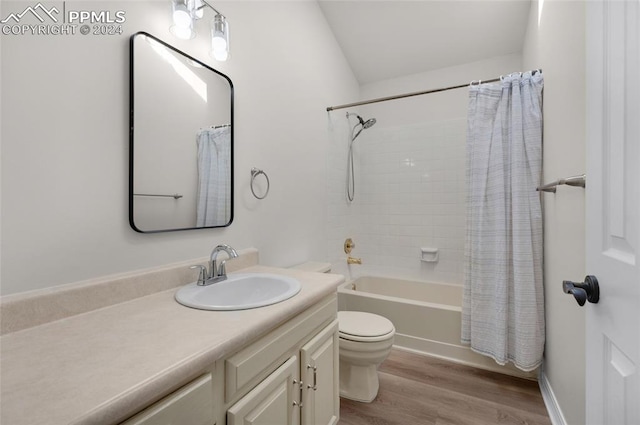 full bathroom featuring shower / bath combination with curtain, vanity, hardwood / wood-style floors, and toilet