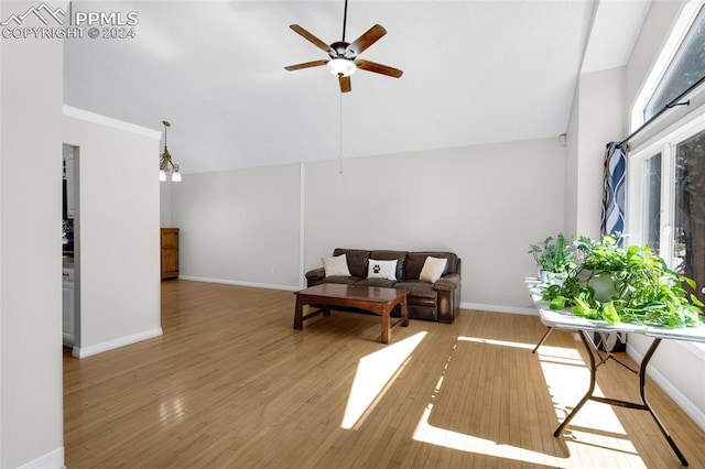 sitting room with light hardwood / wood-style floors, vaulted ceiling, plenty of natural light, and ceiling fan