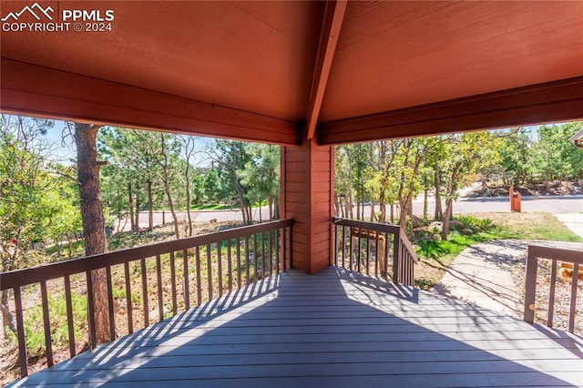 wooden terrace featuring a gazebo