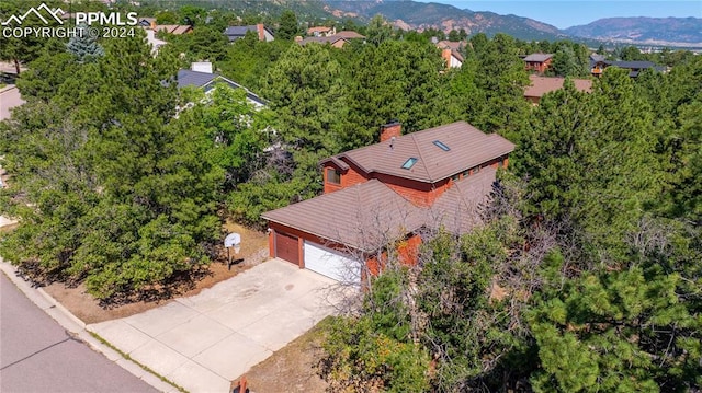 birds eye view of property featuring a mountain view