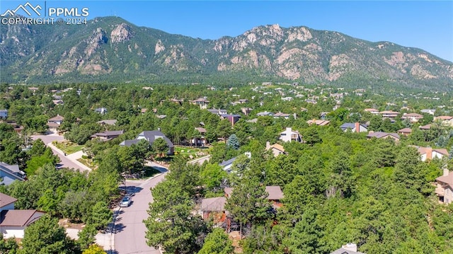 birds eye view of property with a mountain view