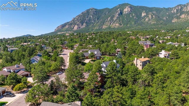 birds eye view of property with a mountain view