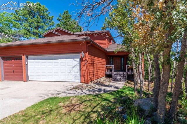 view of side of home featuring a garage