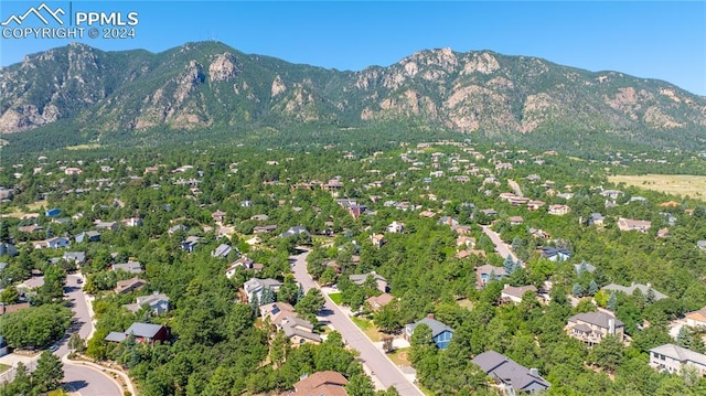 birds eye view of property featuring a mountain view