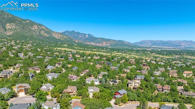 birds eye view of property with a mountain view