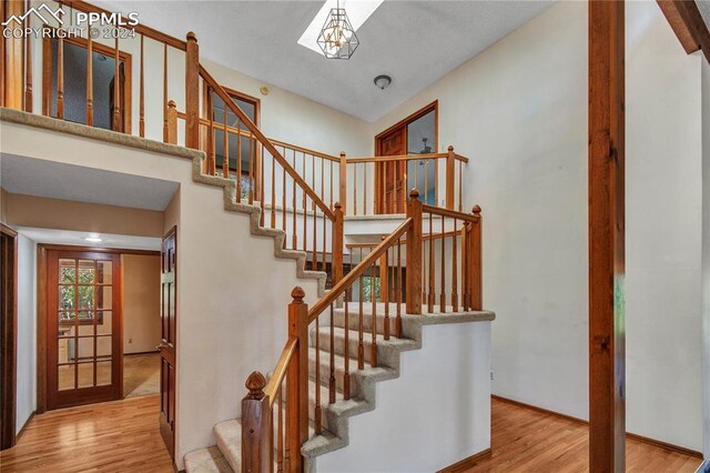 stairway featuring light wood-type flooring