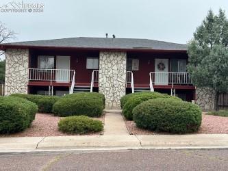 1105 Cree Dr, Colorado Springs, CO 80915 - view of front of house featuring stone siding