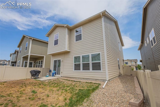 back of house with a patio area