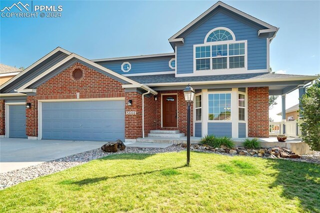 front of property with a garage and a front yard