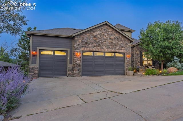 view of front of property with a garage