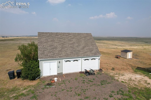 garage with a rural view