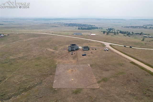 birds eye view of property featuring a rural view