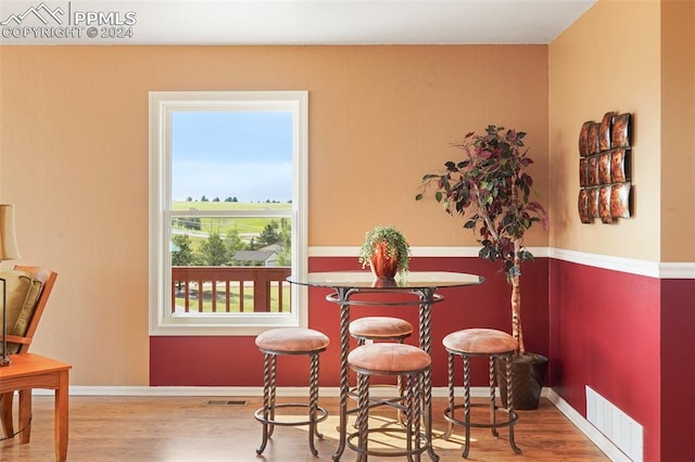 dining space featuring hardwood / wood-style floors