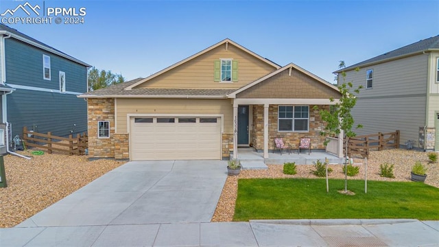 craftsman-style home featuring a front lawn