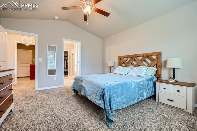 carpeted bedroom with vaulted ceiling and ceiling fan