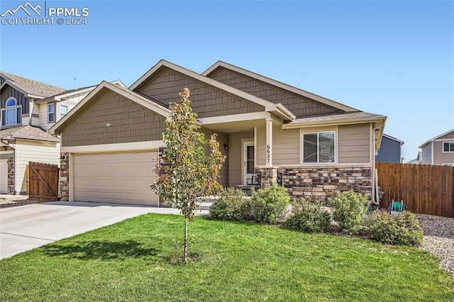 craftsman-style home with a front yard