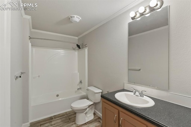 full bathroom with bathtub / shower combination, toilet, vanity, and ornamental molding