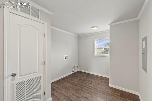 washroom with washer hookup, dark wood-type flooring, electric panel, and ornamental molding