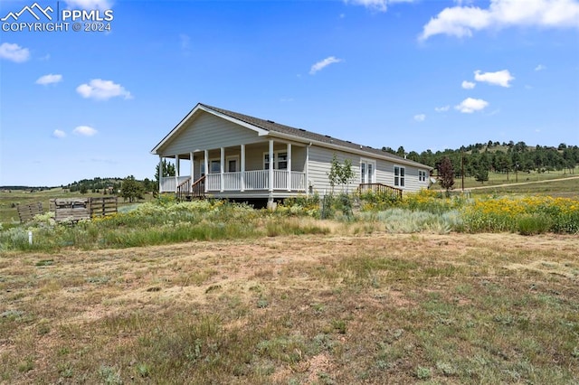 view of property exterior with a porch