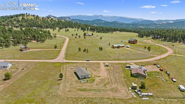 birds eye view of property with a rural view and a mountain view