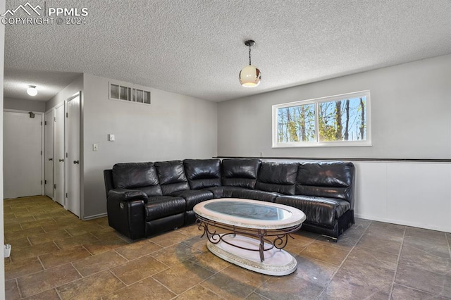 living room with a textured ceiling