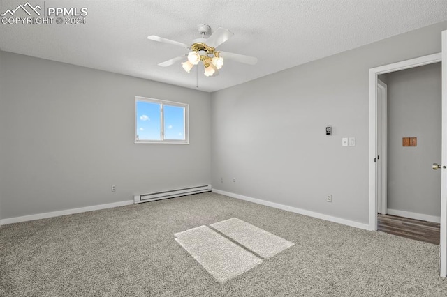 carpeted spare room featuring a textured ceiling, baseboard heating, and ceiling fan